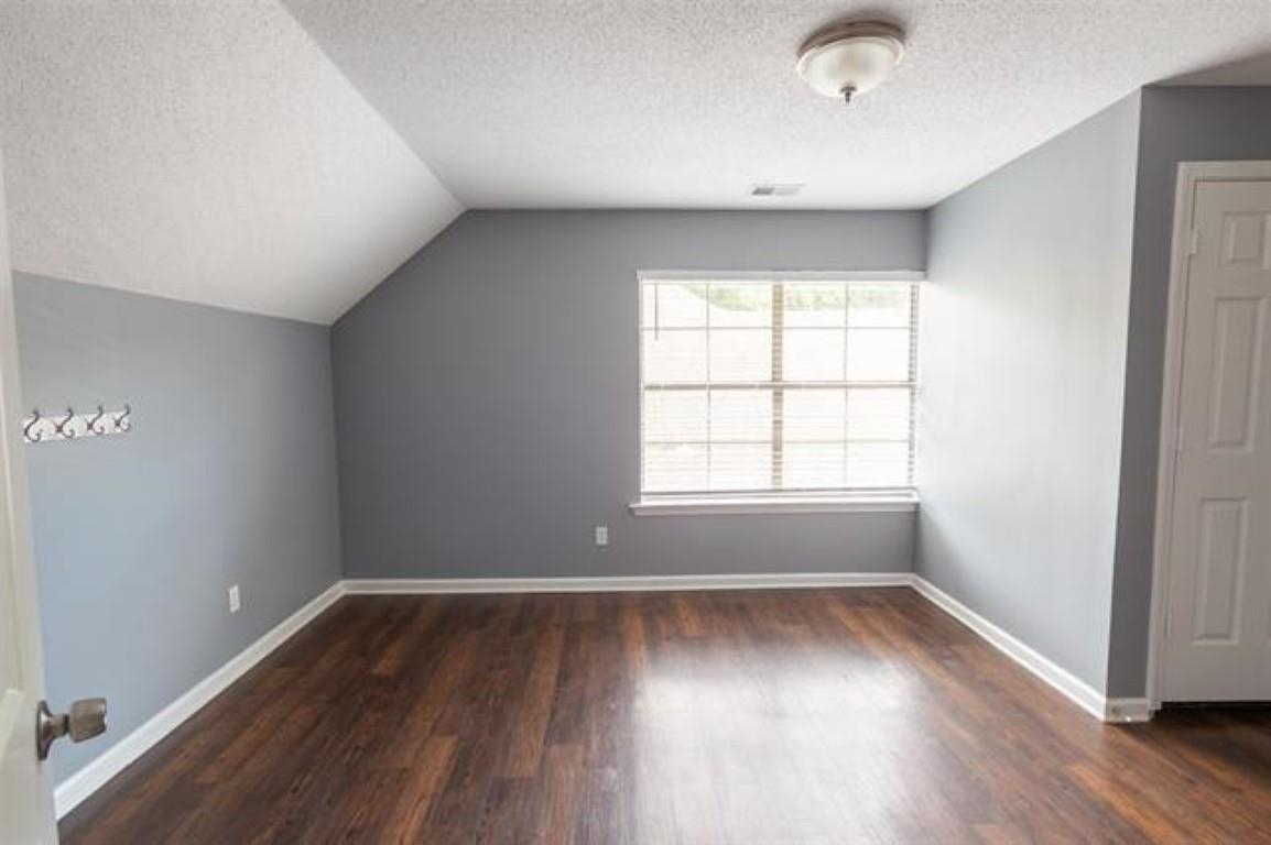 3430 Roxee Run Cove Bartlett, TN 38133 - Photo 21 of 32 an empty room with wooden floor and windows