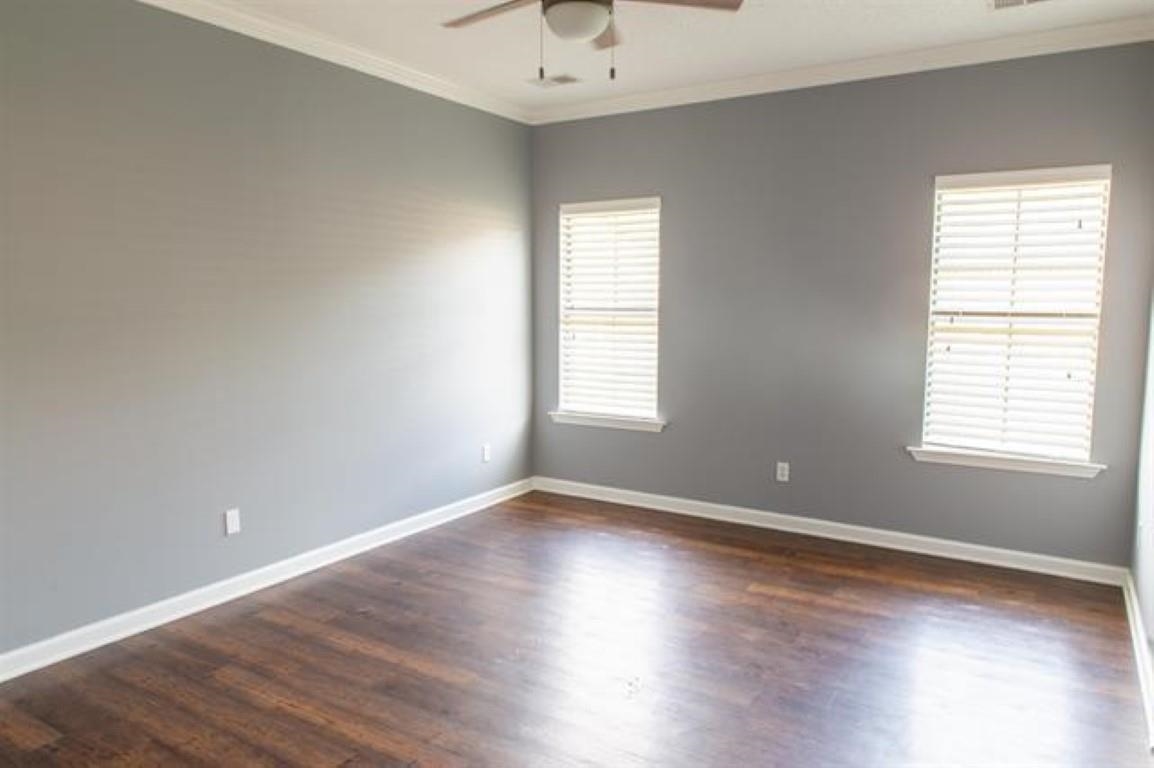 3430 Roxee Run Cove Bartlett, TN 38133 - Photo 23 of 32 an empty room with wooden floor and windows