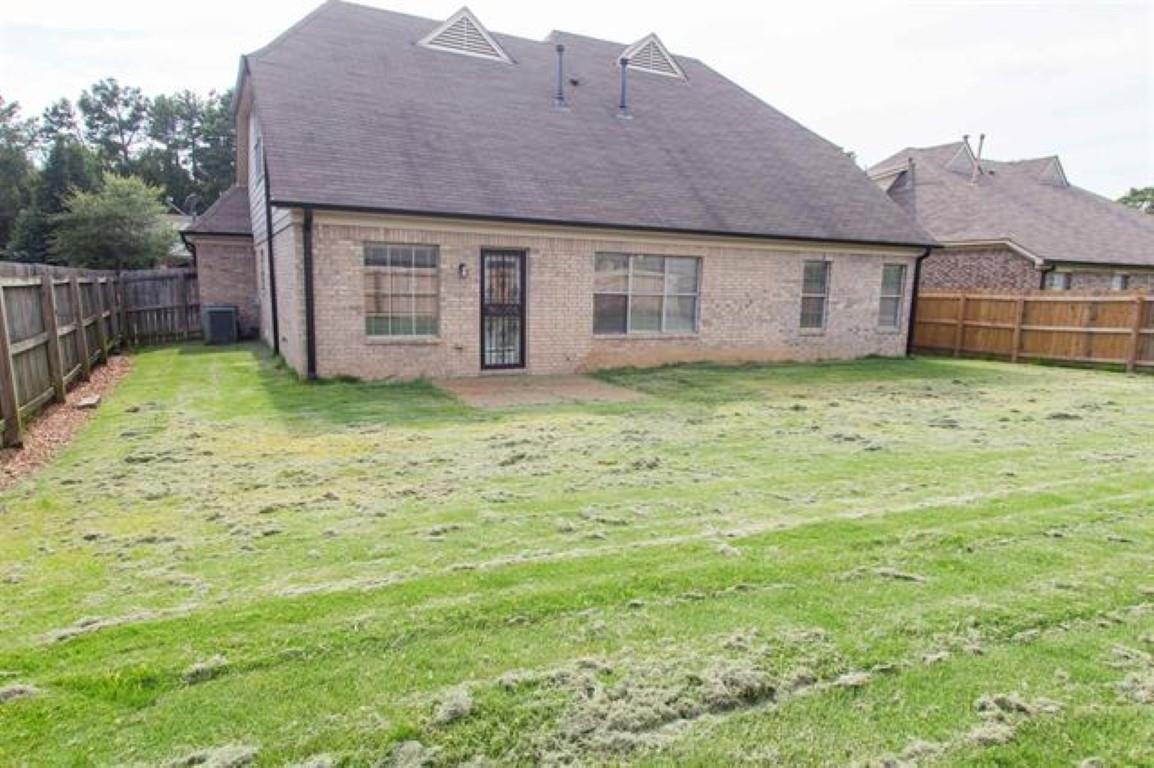 3430 Roxee Run Cove Bartlett, TN 38133 - Photo 26 of 32 a backyard of a house