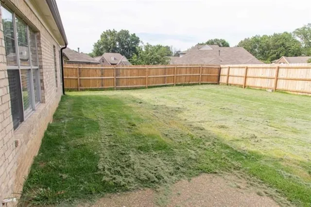 a view of outdoor space with backyard