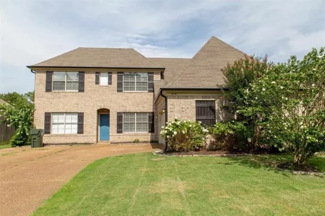 front view of a house with a yard