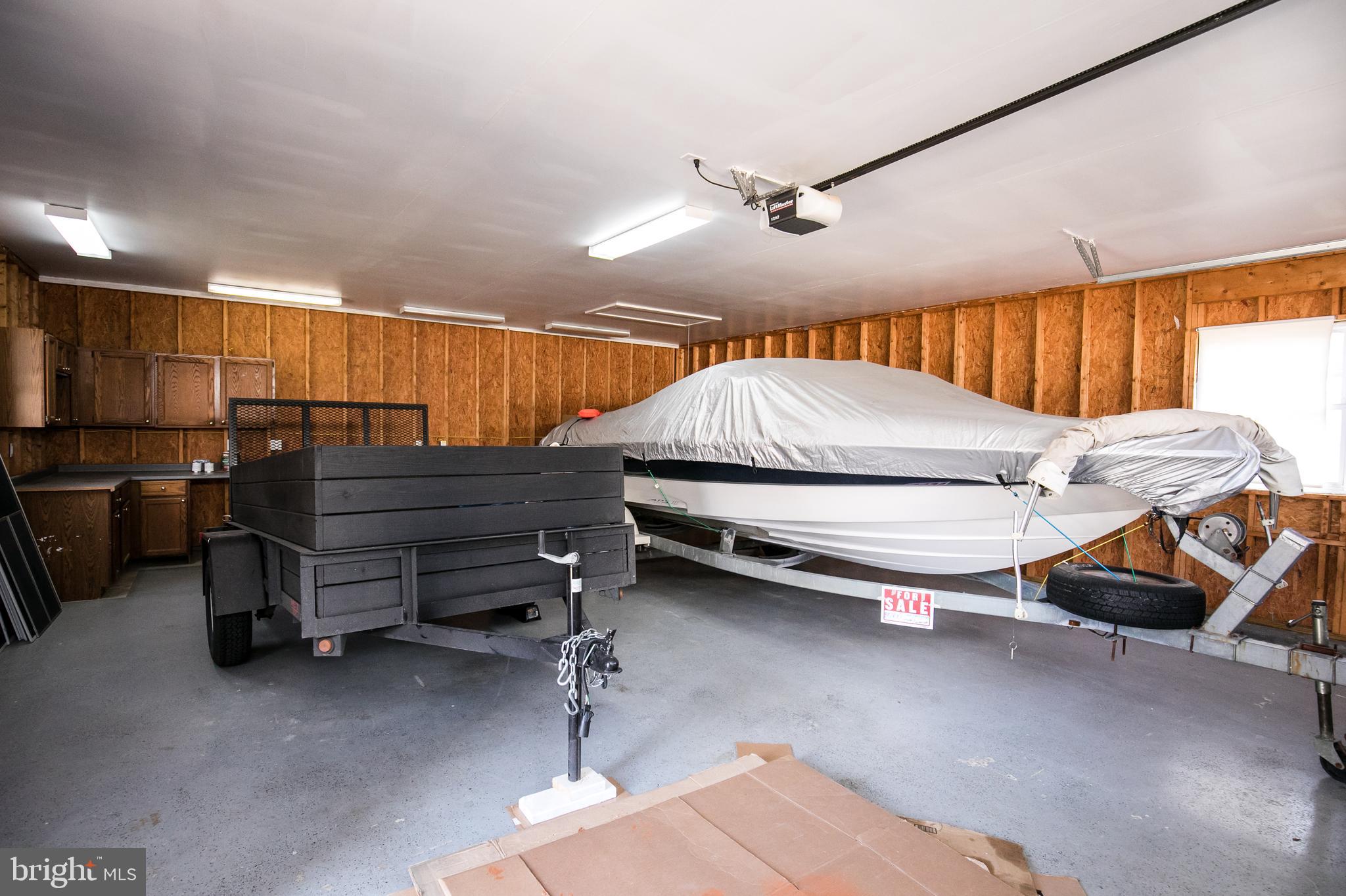 108 River Road Edgewater, MD 21037 - Photo 33 of 38 Oversized garage can store boat and trailer!