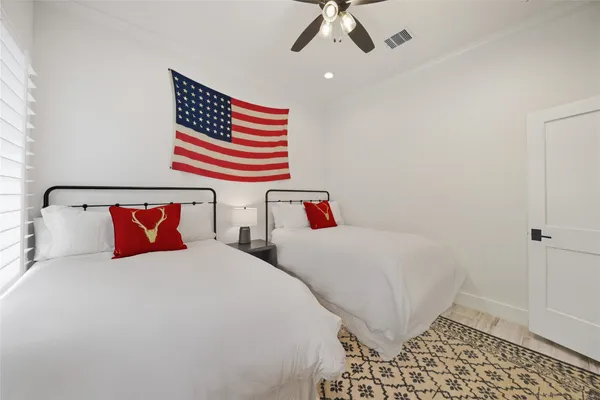 a bedroom with a bed and dresser