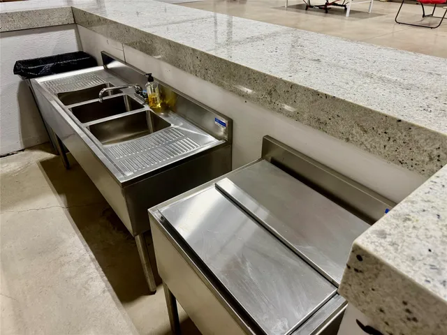 a stove top oven sitting inside of a kitchen counter space