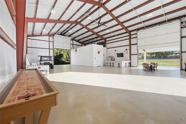 a view of a living room and kitchen