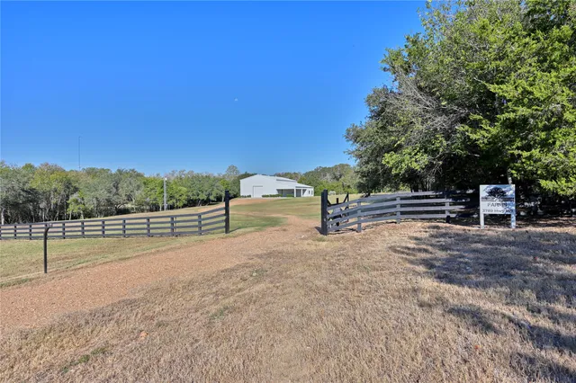 an aerial view of house with yard