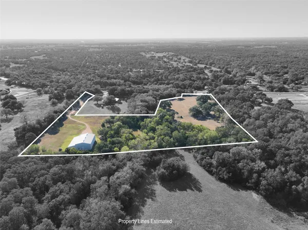 an aerial view of house with yard