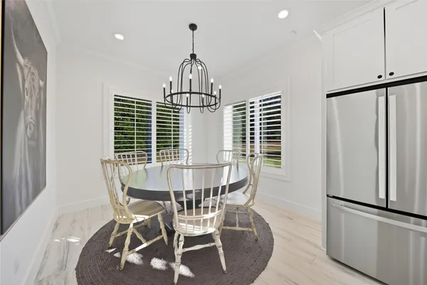 a view of dining room and wooden floor
