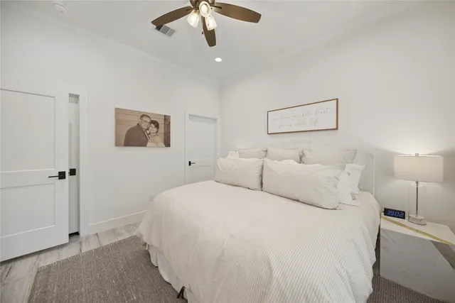 a large white bed in a white room