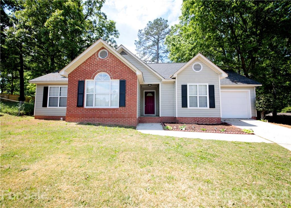 109 Ferntree Court Columbia, SC 29210 - Photo 2 of 34 a front view of a house with a yard and garage
