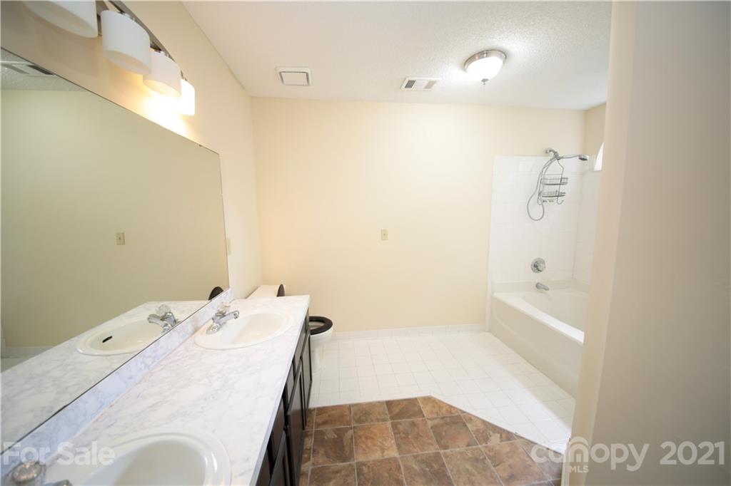 109 Ferntree Court Columbia, SC 29210 - Photo 18 of 34 a bathroom with a bathtub and shower