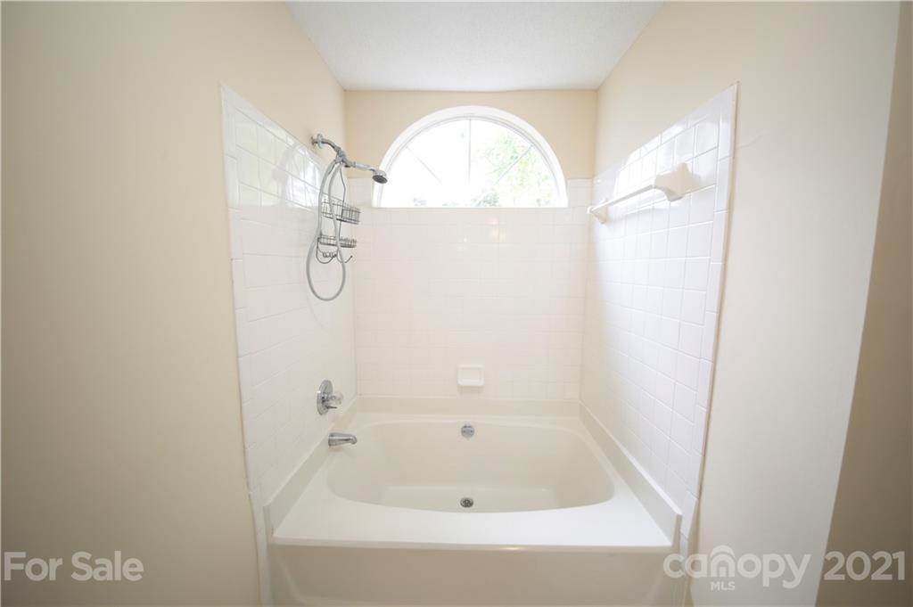 109 Ferntree Court Columbia, SC 29210 - Photo 20 of 34 a bathroom with a glass shower door