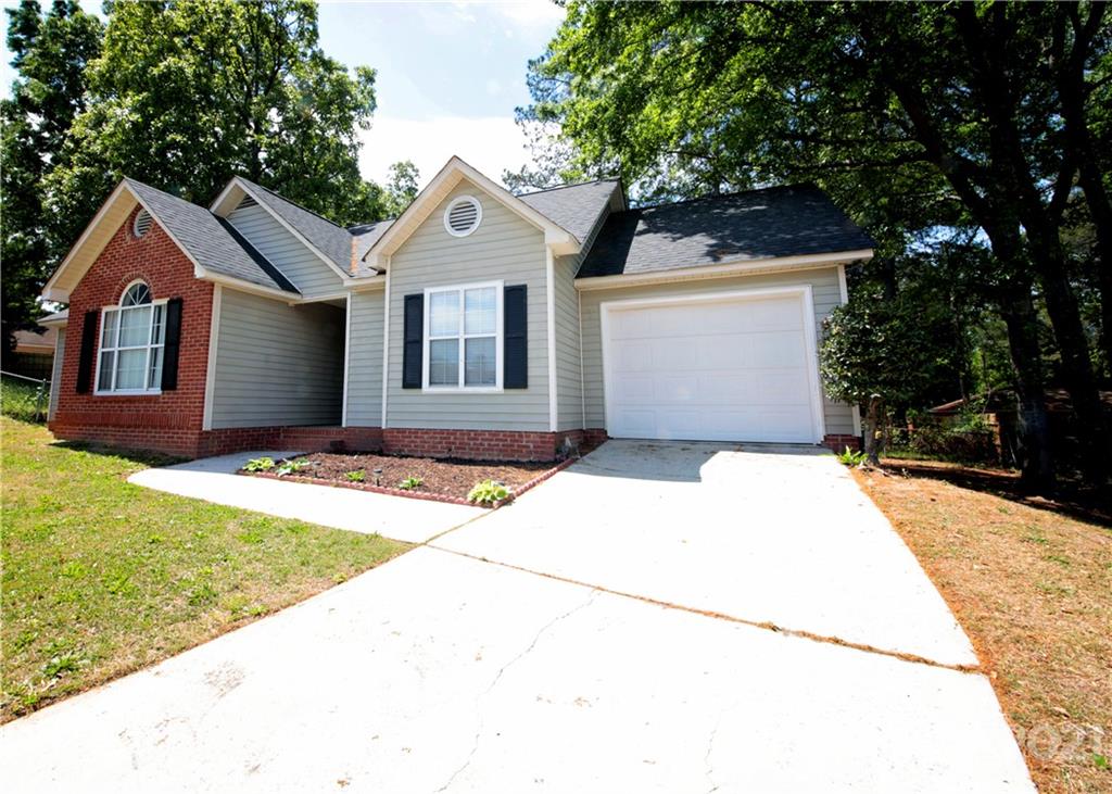 109 Ferntree Court Columbia, SC 29210 - Photo 3 of 34 a front view of a house with a yard and garage