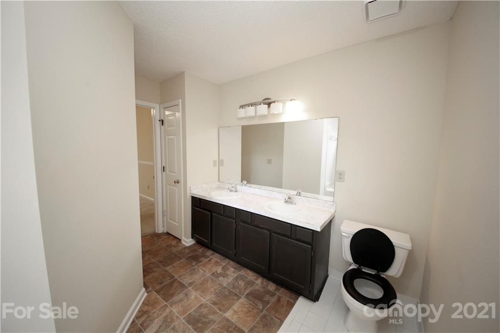 109 Ferntree Court Columbia, SC 29210 - Photo 21 of 34 a bathroom with a granite countertop sink mirror vanity and bathtub