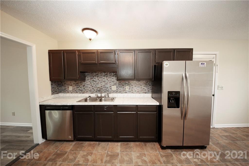 109 Ferntree Court Columbia, SC 29210 - Photo 28 of 34 a kitchen with stainless steel appliances granite countertop a refrigerator and a sink