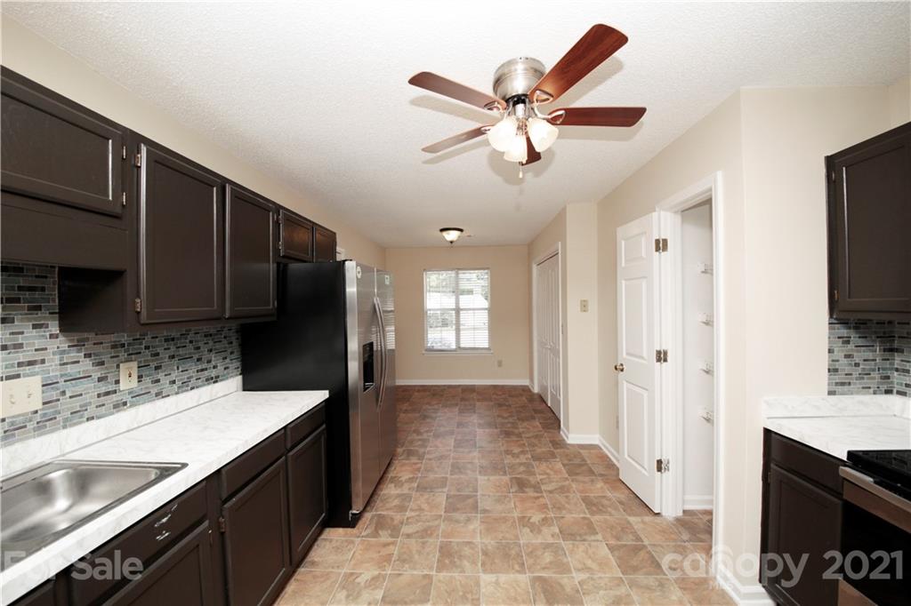109 Ferntree Court Columbia, SC 29210 - Photo 30 of 34 a view of a kitchen with a sink and a refrigerator