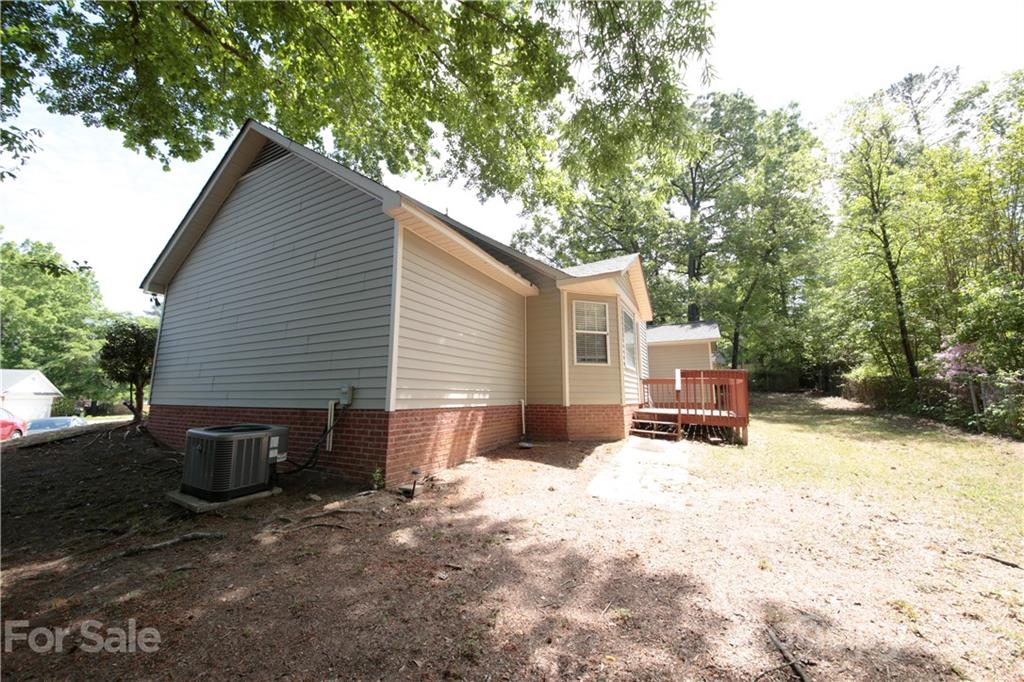 109 Ferntree Court Columbia, SC 29210 - Photo 34 of 34 a backyard of a house with fire pit and trees