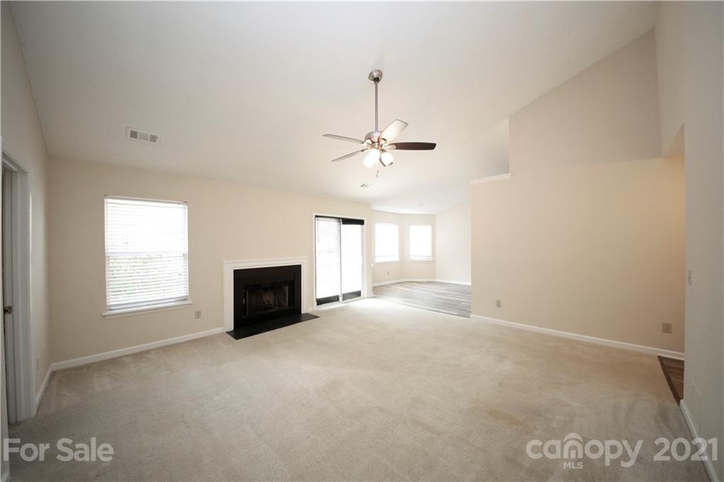 109 Ferntree Court Columbia, SC 29210 - Photo 8 of 34 an empty room with windows and fan