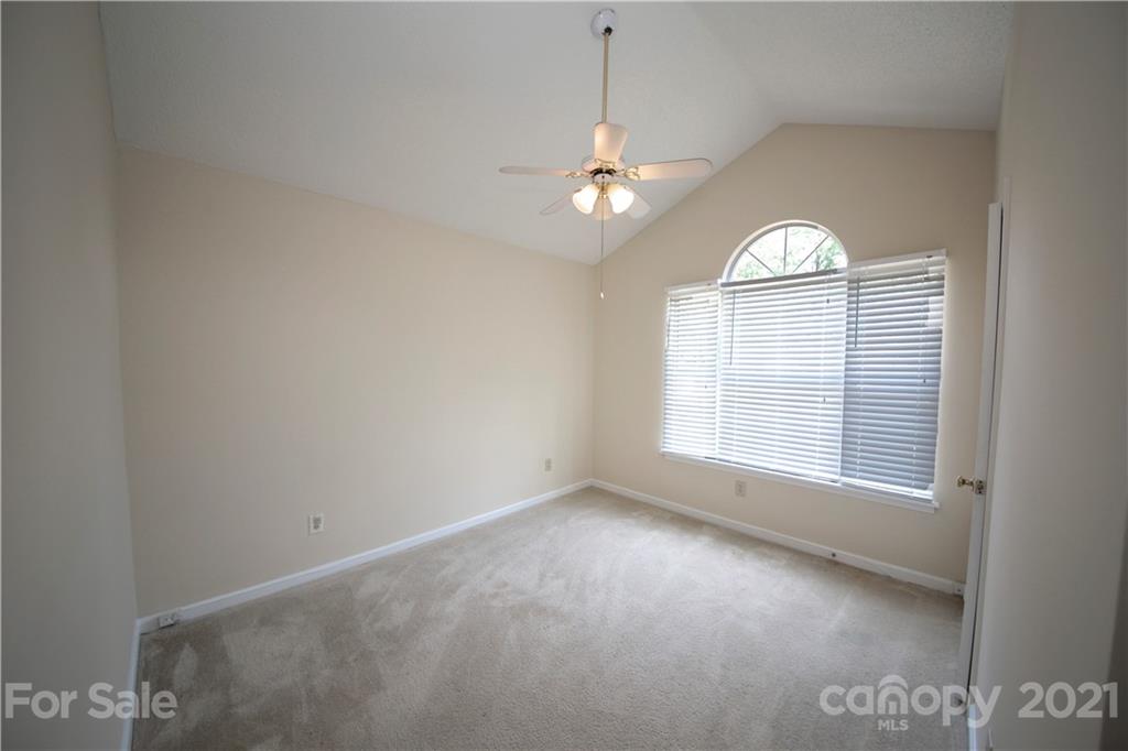 109 Ferntree Court Columbia, SC 29210 - Photo 9 of 34 an empty room with a window and wooden floor