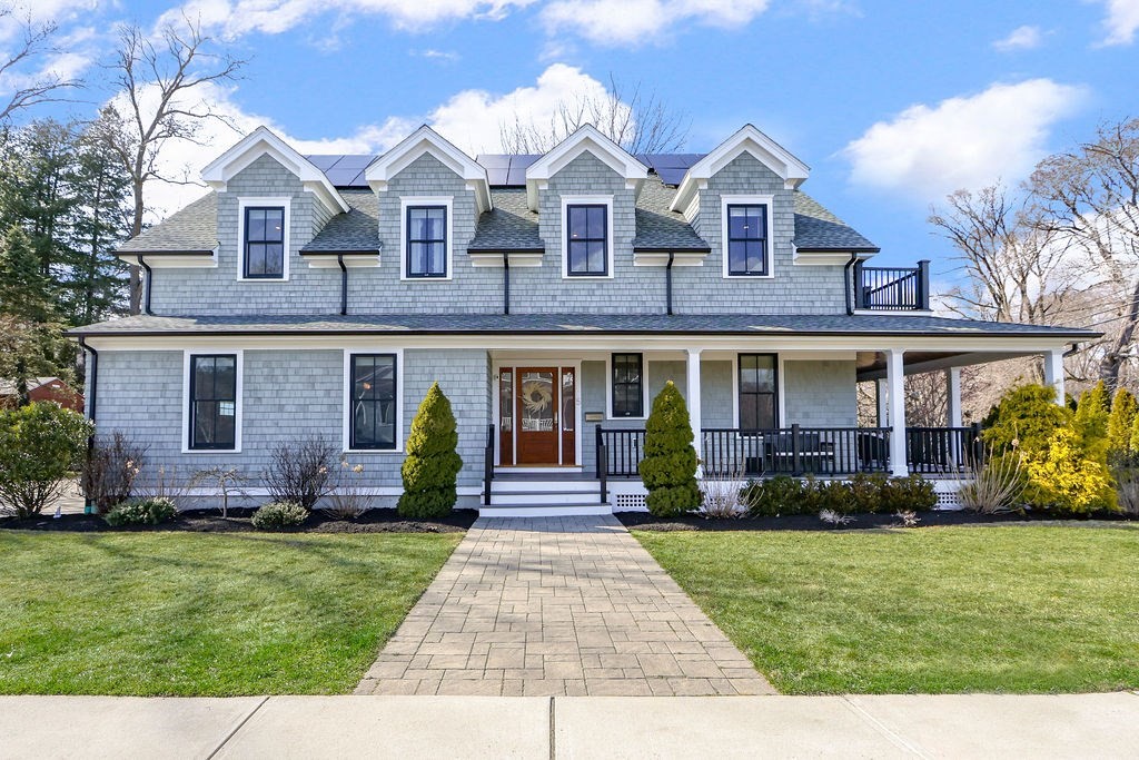 5 Sharpe Road Newton, MA 02459 - Photo 1 of 41 a front view of a house with a yard