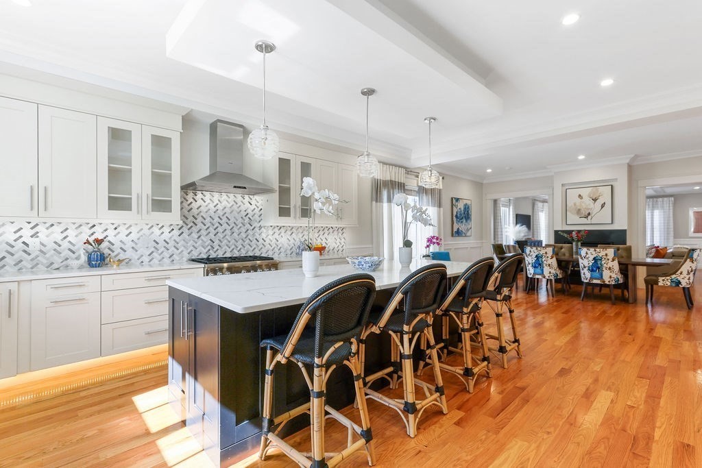 5 Sharpe Road Newton, MA 02459 - Photo 17 of 41 a kitchen with lots of counter top space and painting on the wall