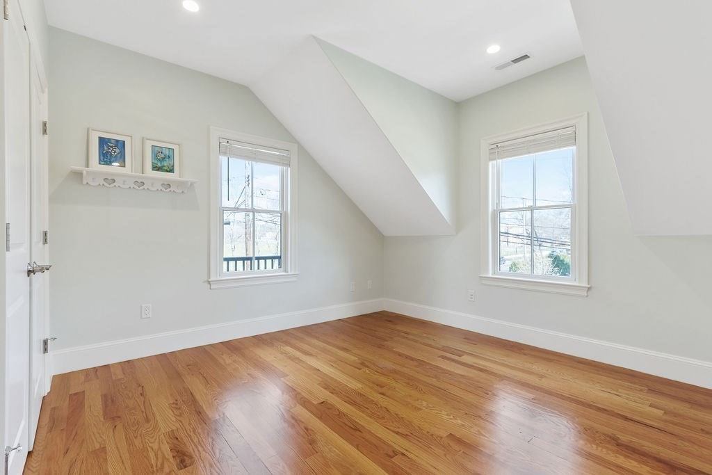 5 Sharpe Road Newton, MA 02459 - Photo 18 of 41 a view of an empty room with wooden floor and a window