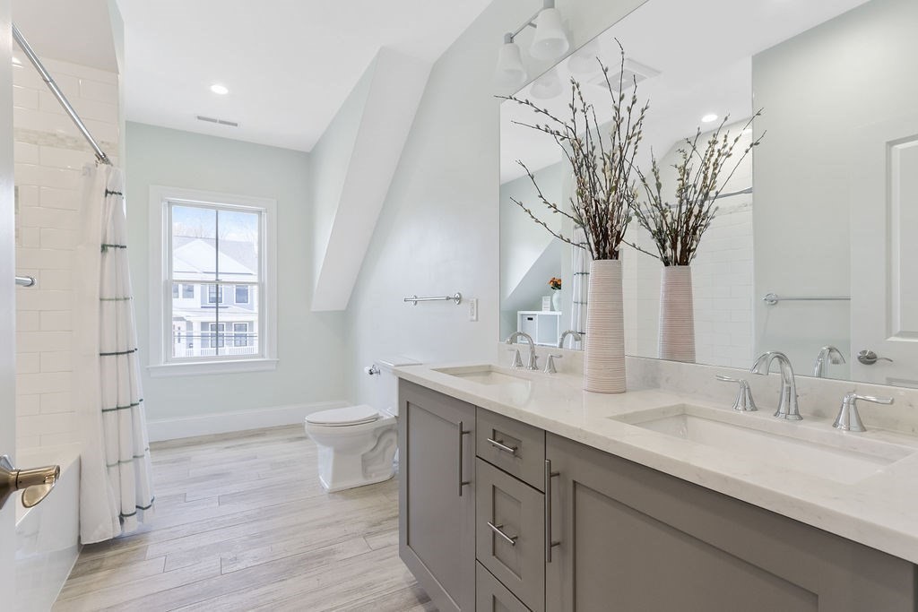 5 Sharpe Road Newton, MA 02459 - Photo 20 of 41 a spacious bathroom with a sink a toilet and a large mirror