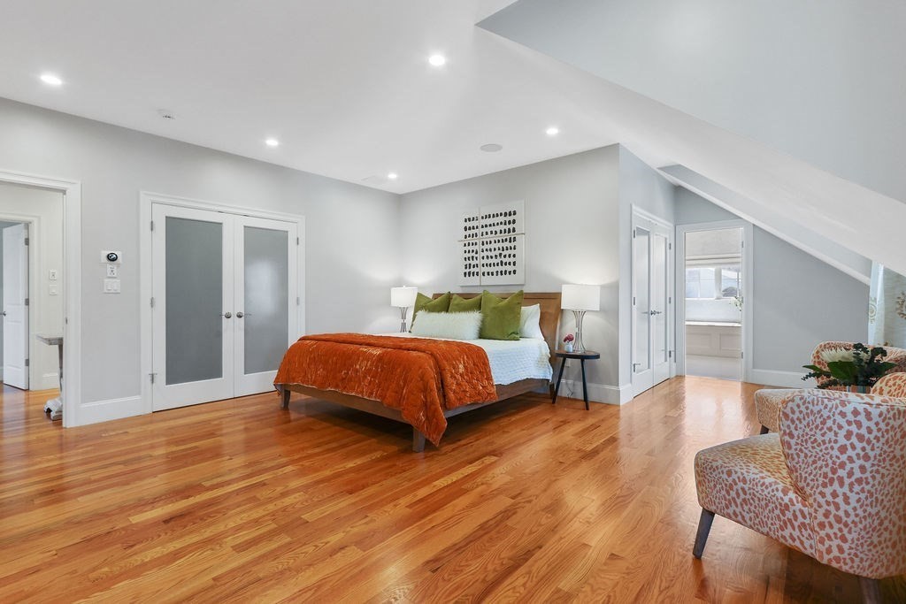 5 Sharpe Road Newton, MA 02459 - Photo 23 of 41 a spacious bedroom with a bed and wooden floor