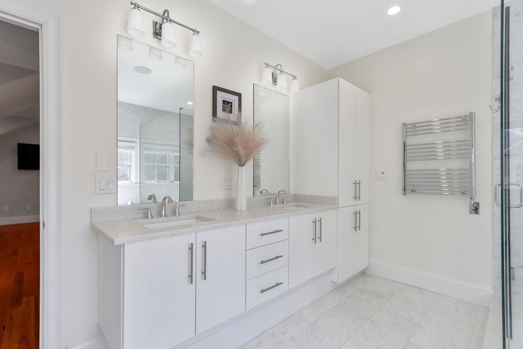 5 Sharpe Road Newton, MA 02459 - Photo 26 of 41 a spacious bathroom with double sink and a mirror