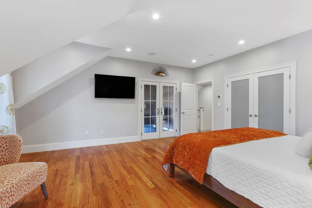 5 Sharpe Road Newton, MA 02459 - Photo 27 of 41 a bedroom with a bed and a flat screen tv