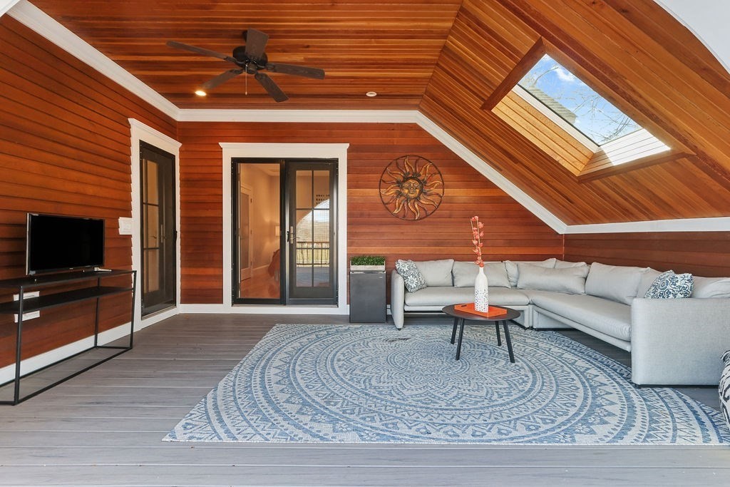 5 Sharpe Road Newton, MA 02459 - Photo 30 of 41 a living room with furniture and a flat screen tv