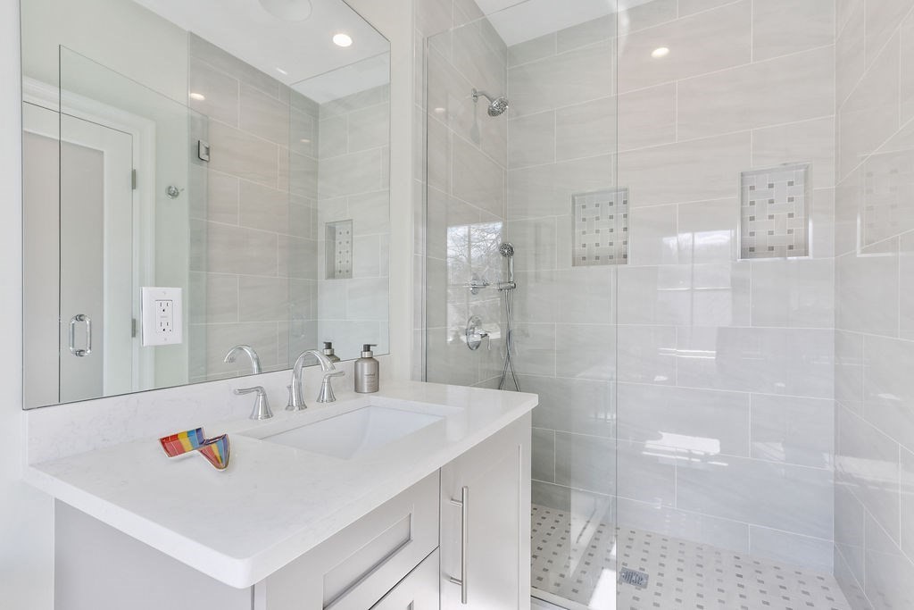 5 Sharpe Road Newton, MA 02459 - Photo 33 of 41 a bathroom with a sink a shower and a mirror