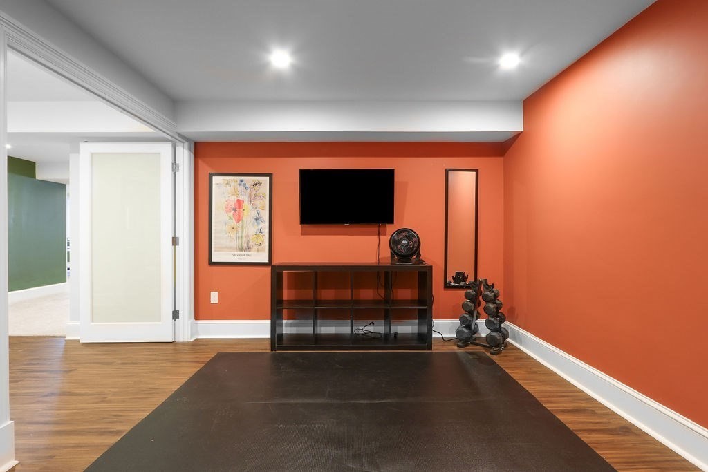 5 Sharpe Road Newton, MA 02459 - Photo 36 of 41 wooden floor in an empty room with a window