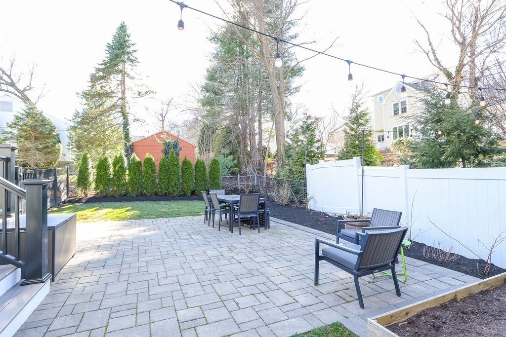 5 Sharpe Road Newton, MA 02459 - Photo 37 of 41 a view of a patio with a table and chairs