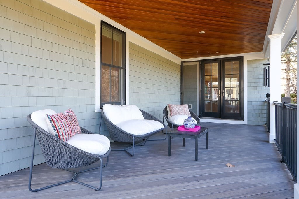 5 Sharpe Road Newton, MA 02459 - Photo 38 of 41 a backyard of a house with wooden seating