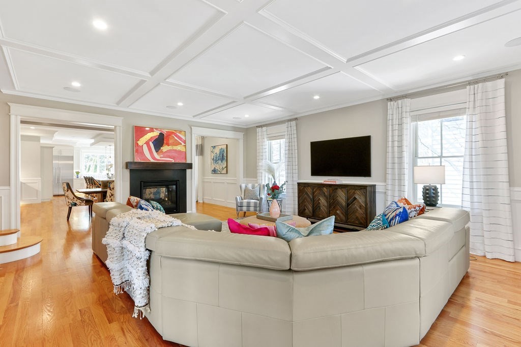 5 Sharpe Road Newton, MA 02459 - Photo 9 of 41 a living room with furniture a flat screen tv and a fireplace