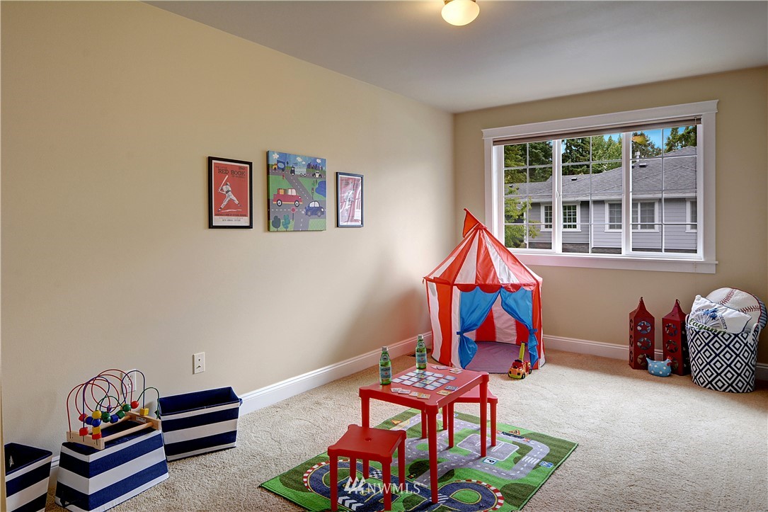 907 225th Place Southeast Bothell, WA 98021 - Photo 14 of 20 a room with toys and a wooden floor