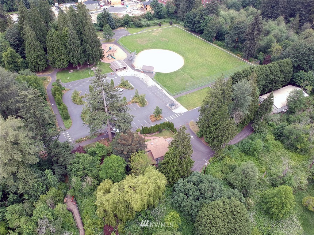 907 225th Place Southeast Bothell, WA 98021 - Photo 20 of 20 an aerial view of a house with a yard and greenery