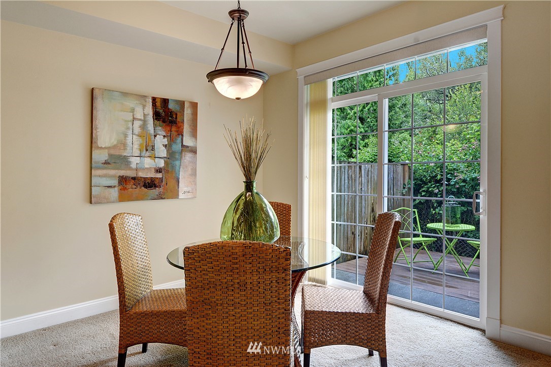 907 225th Place Southeast Bothell, WA 98021 - Photo 6 of 20 a view of a dining room with furniture wooden floor and chandelier
