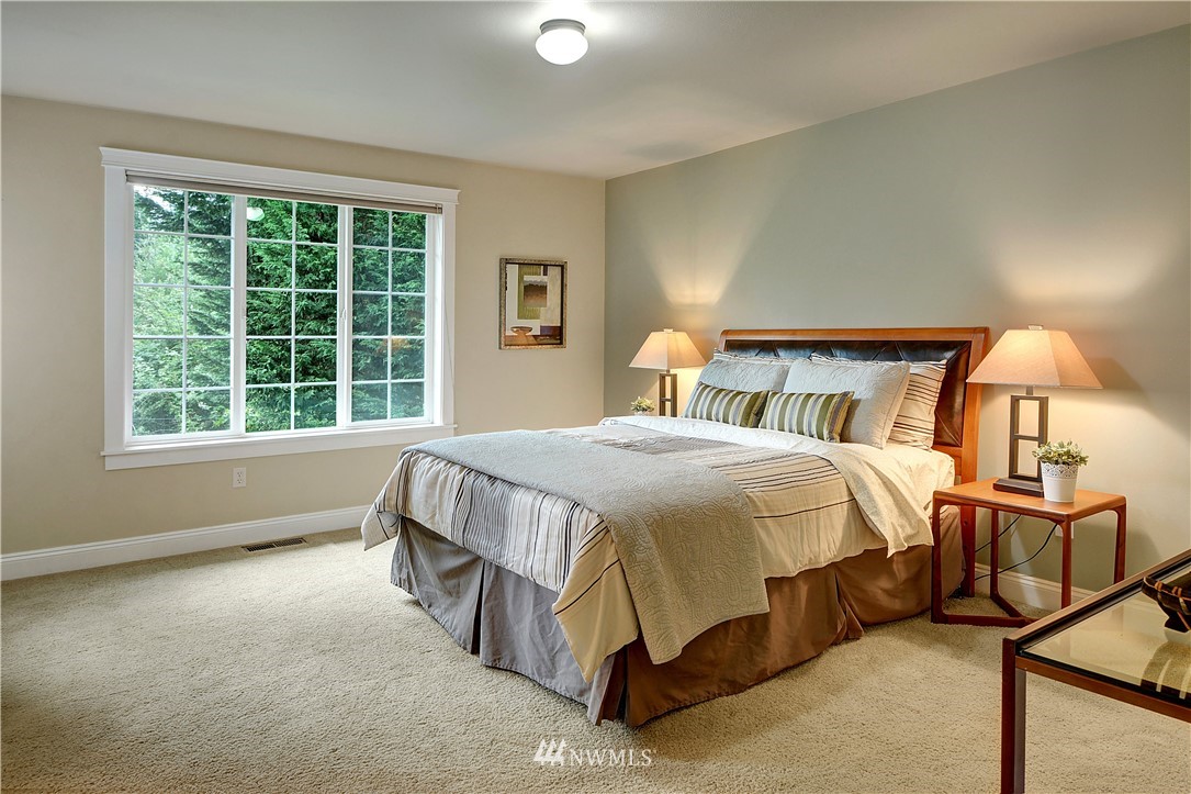 907 225th Place Southeast Bothell, WA 98021 - Photo 10 of 20 a spacious bedroom with a bed and window