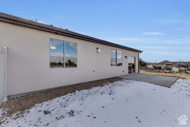 155 East 360th Street East, Unit 10B Fillmore, UT 84631 - Photo 31 of 43 View of snow covered exterior featuring a patio
