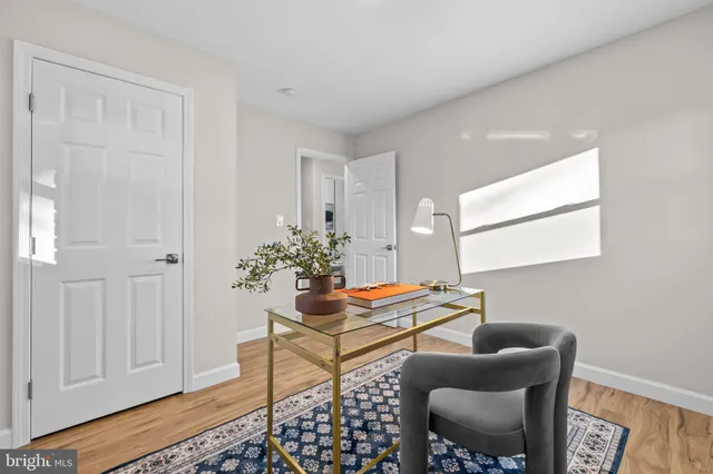 a bedroom with a bed and a potted plant