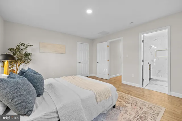 a bathroom with a toilet a sink and a mirror