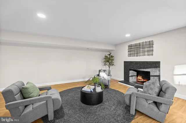 a view of a living room hardwood floor and a ceiling fan