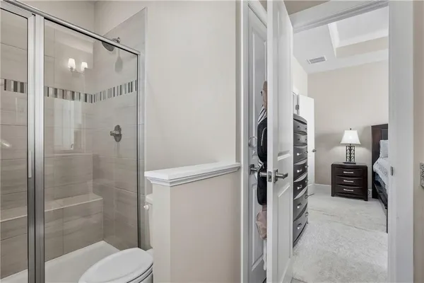 a bathroom with a shower and a toilet