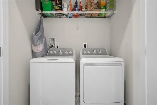 a utility room with dryer and washer