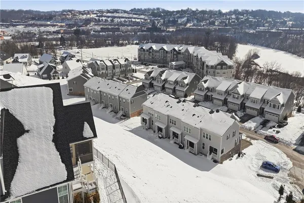 an aerial view of a house with outdoor space