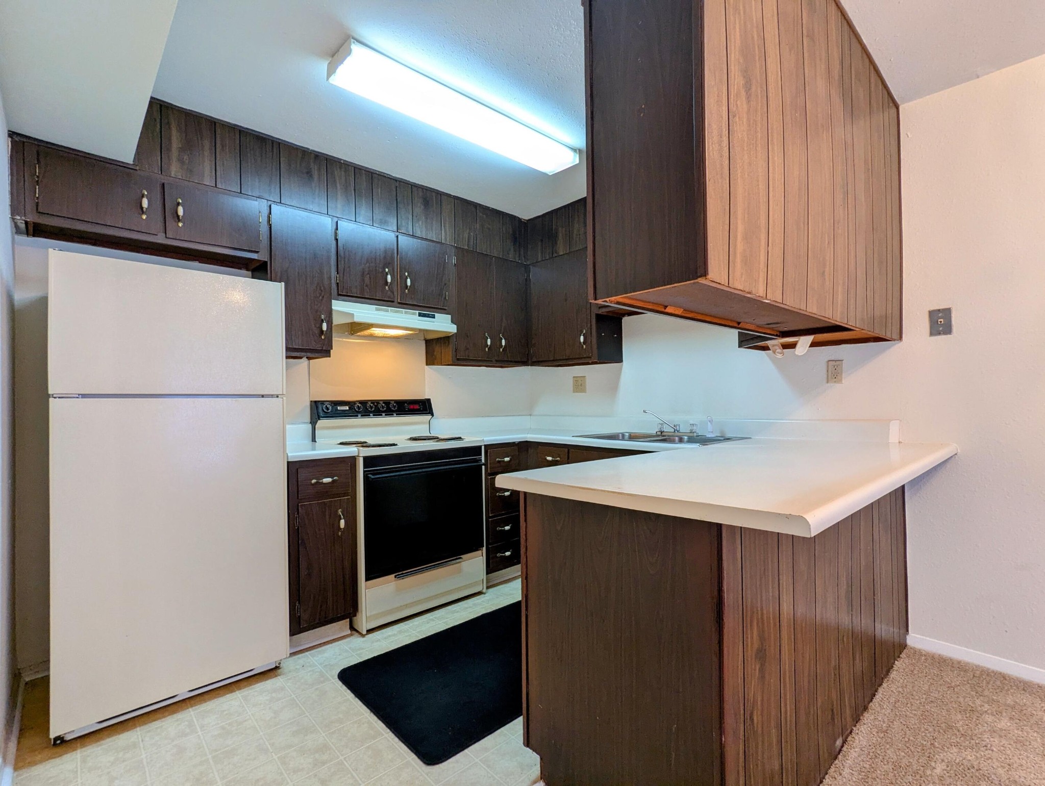 900 Mountain Creek Road, Unit 38 Chattanooga, TN 37405 - Photo 5 of 14 a kitchen with granite countertop stainless steel appliances and wooden cabinets