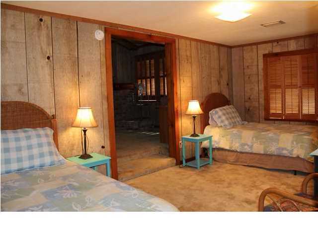 255 Garfield Street Santa Rosa Beach, FL 32459 - Photo 23 of 26 a bedroom with a bed and a window