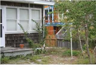 255 Garfield Street Santa Rosa Beach, FL 32459 - Photo 6 of 26 a backyard of a house with lots of green space